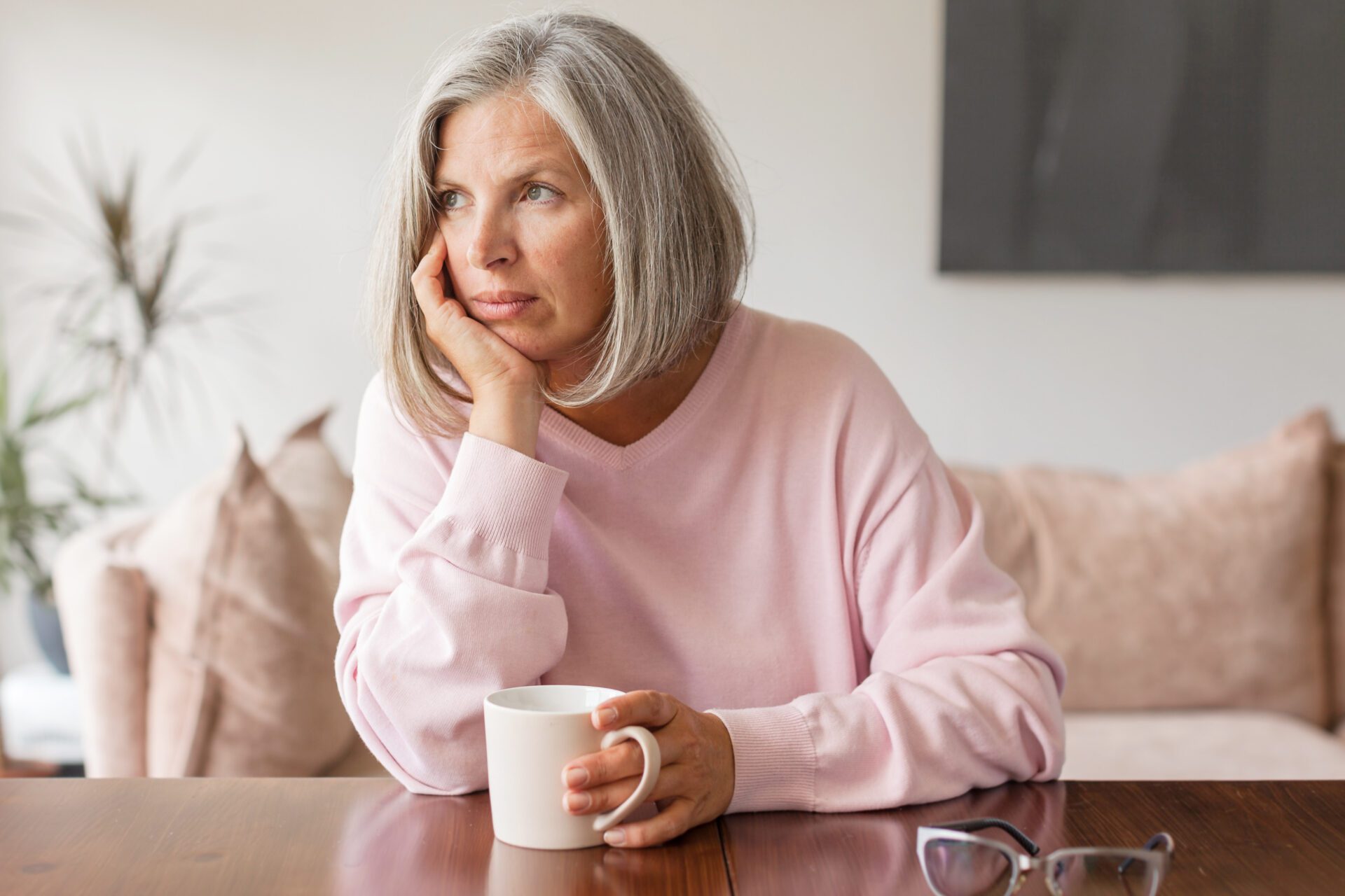 Lonely mature woman suffering from depression at home